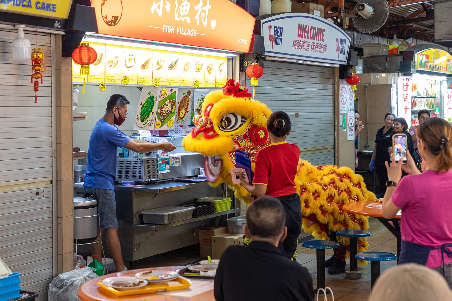 Maxwell Food Centre, a hub for Hainanese Chicken Rice and other local delights.