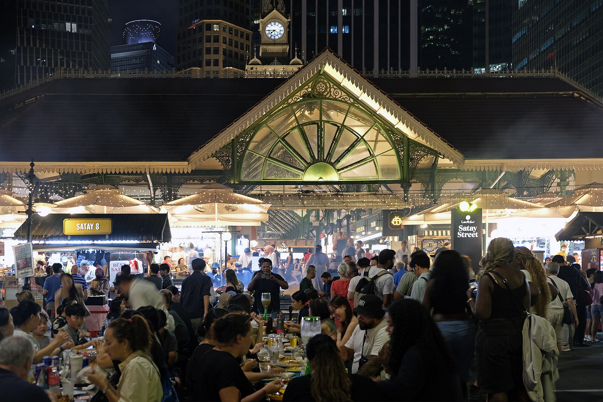 The bustling satay stalls at Lau Pa Sat come alive at night, offering a taste of Singapore's culinary heritage.