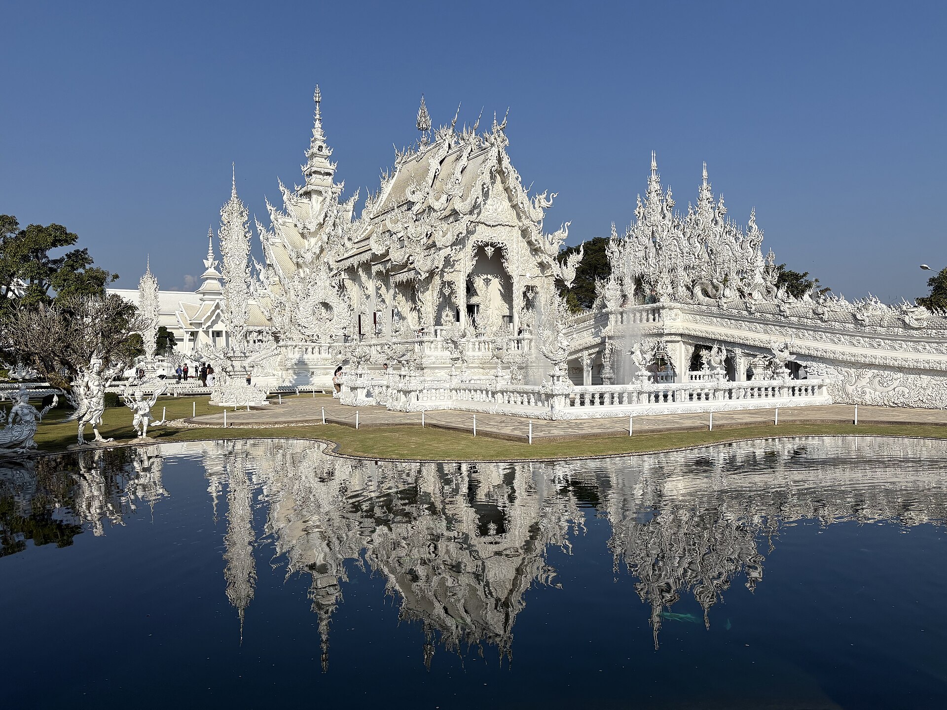 The stunning Wat Rong Khun, known for its intricate white architecture.