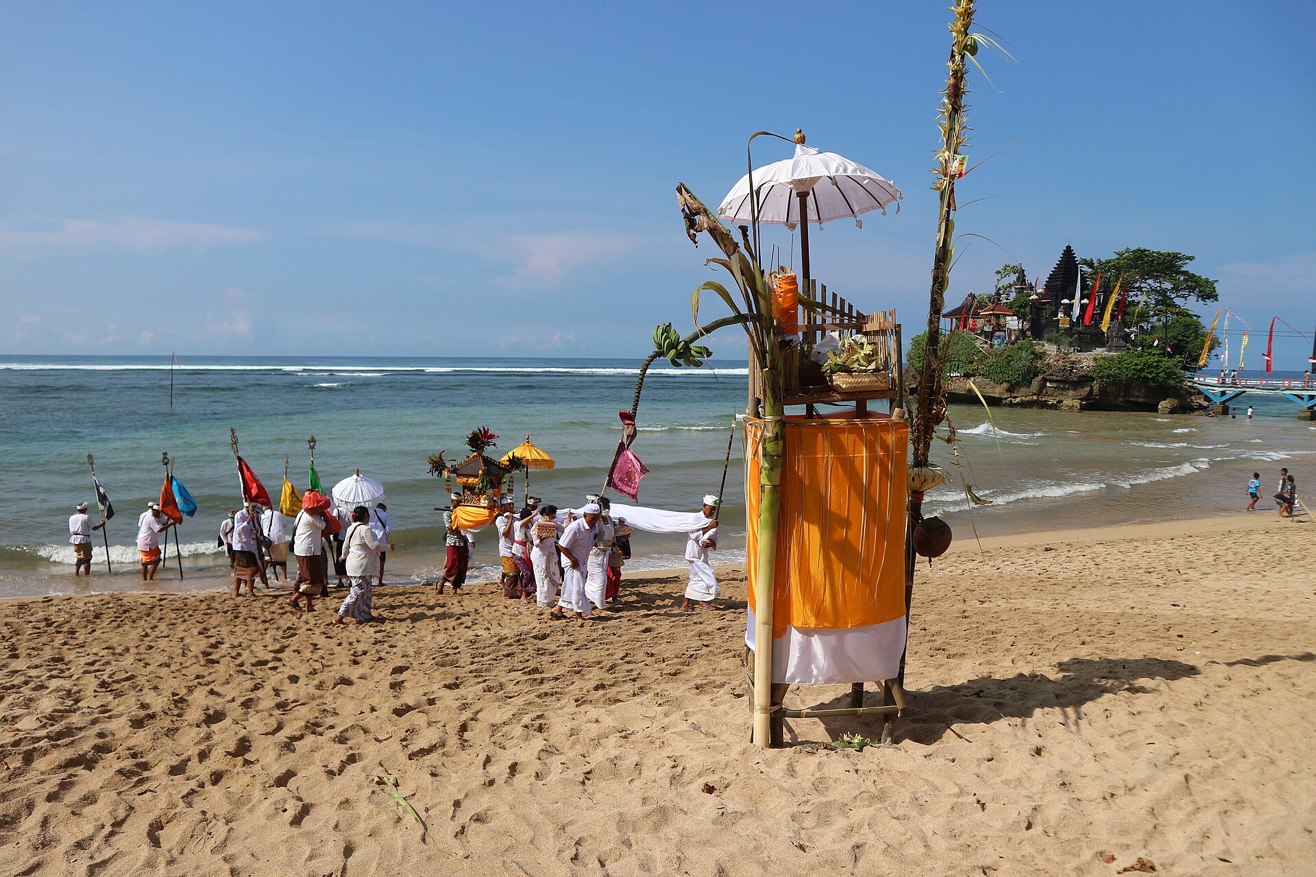 The Melasti ritual purifies sacred objects and prepares the community for Nyepi.
