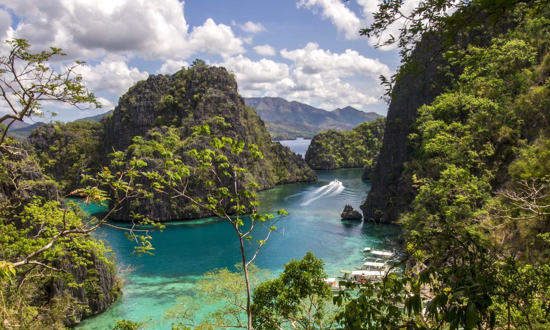 Kayangan Lake, renowned for its crystal-clear waters and stunning limestone cliffs.