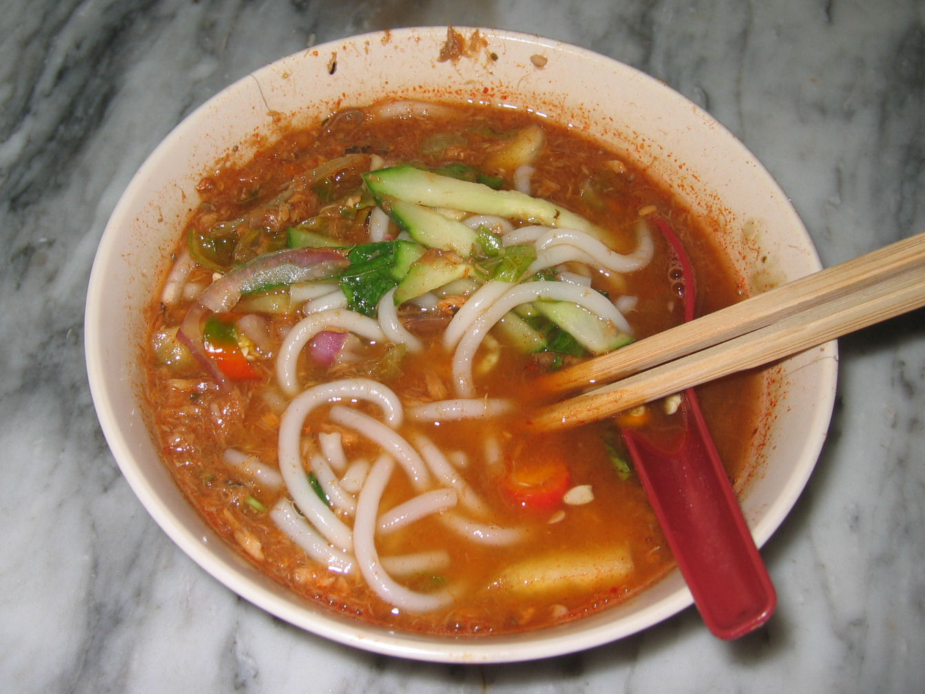 Penang laksa, a must-try dish, showcases the unique flavors of George Town's culinary heritage.