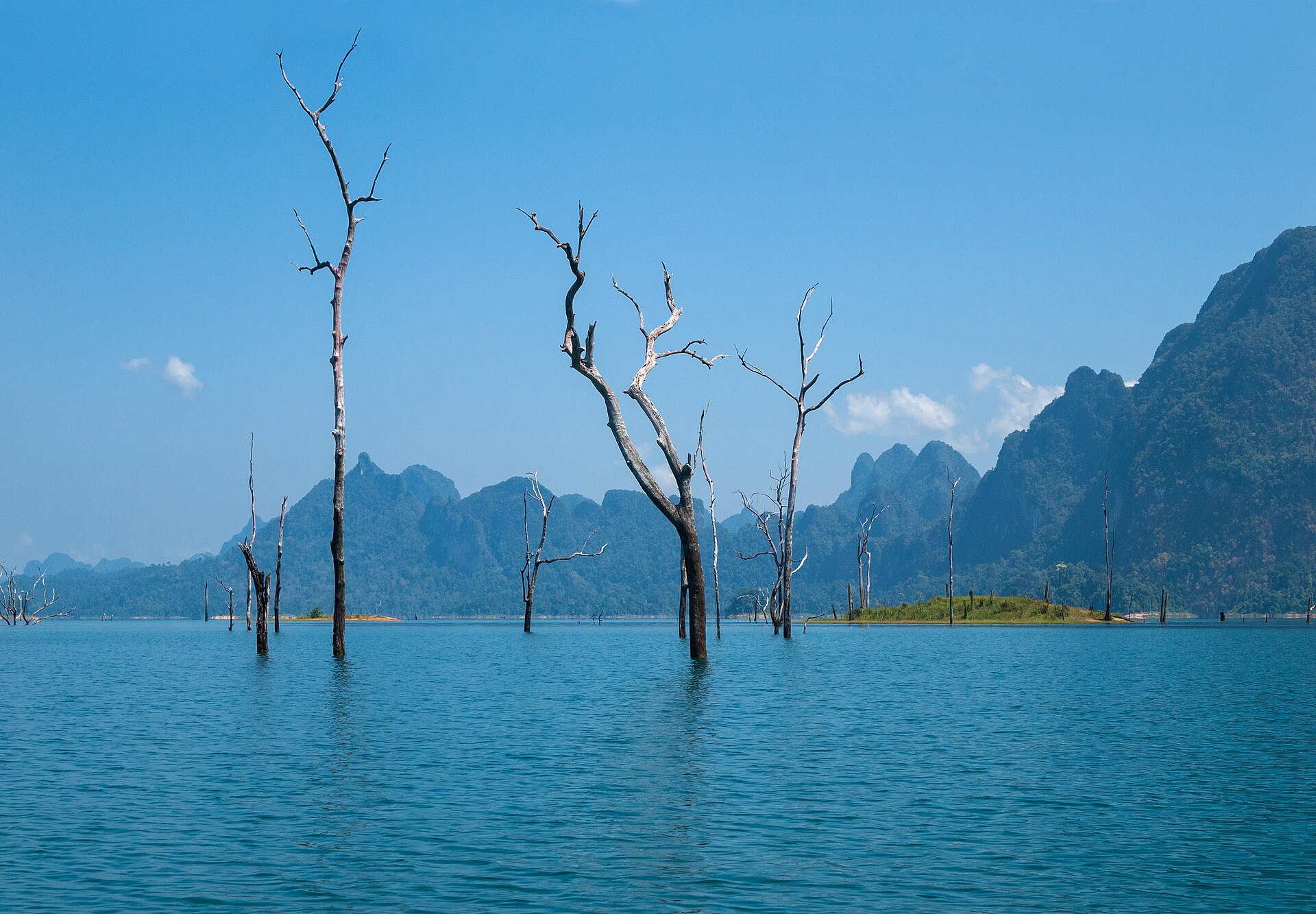 The serene beauty of Cheow Lan Lake, surrounded by limestone cliffs.