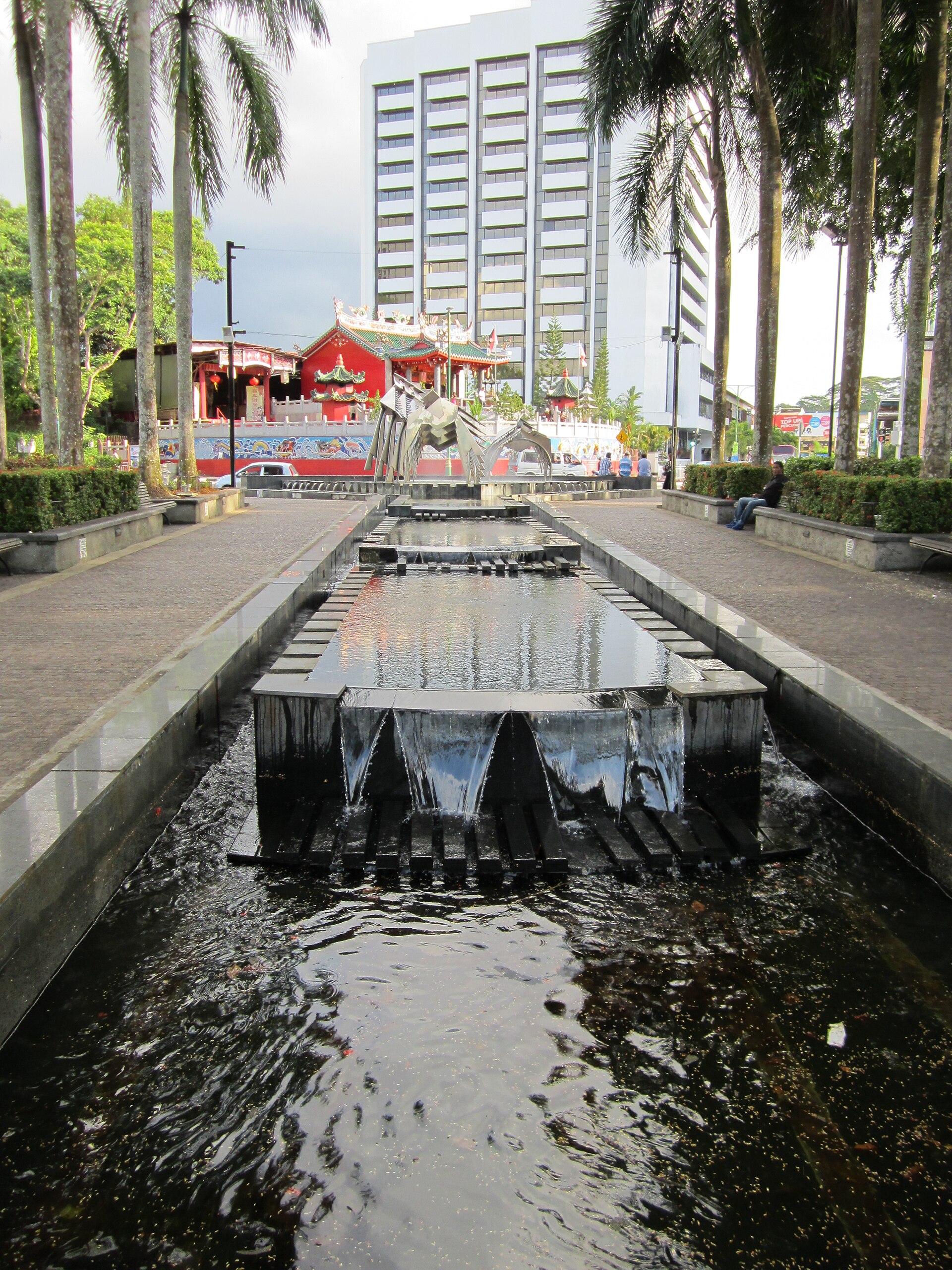 The bustling Kuching waterfront, a hub of local life and culture.