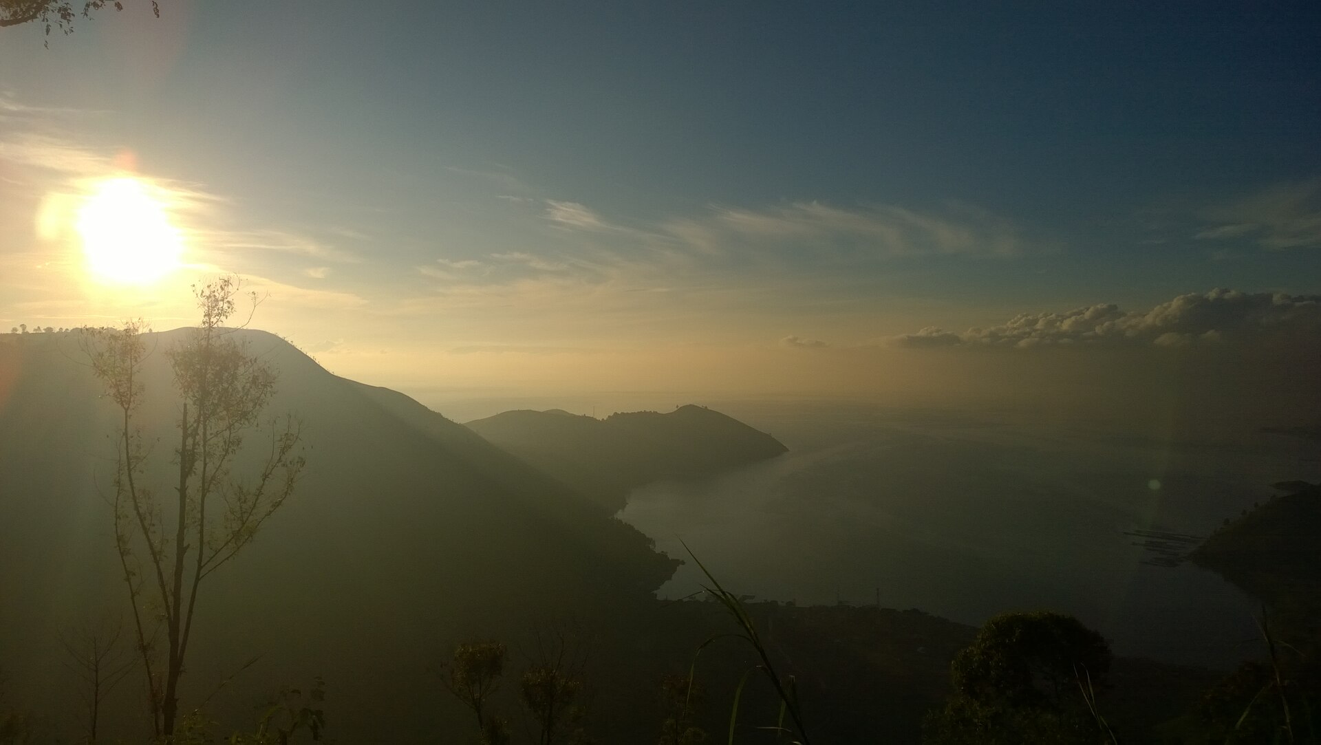 The breathtaking sunrise over Lake Toba, a volcanic lake with stunning views.