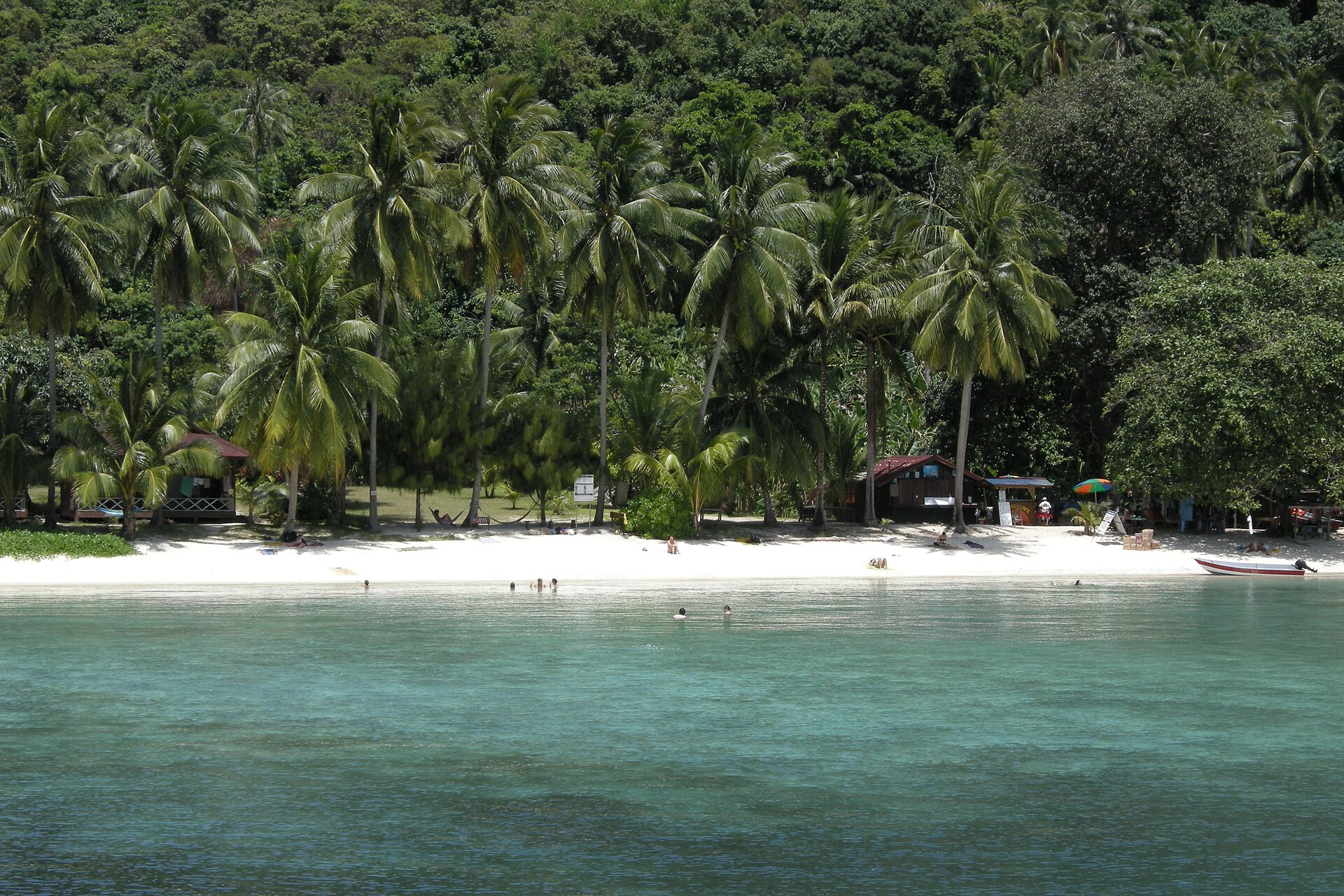 The pristine beaches of Perhentian Kecil invite travelers to relax and unwind.