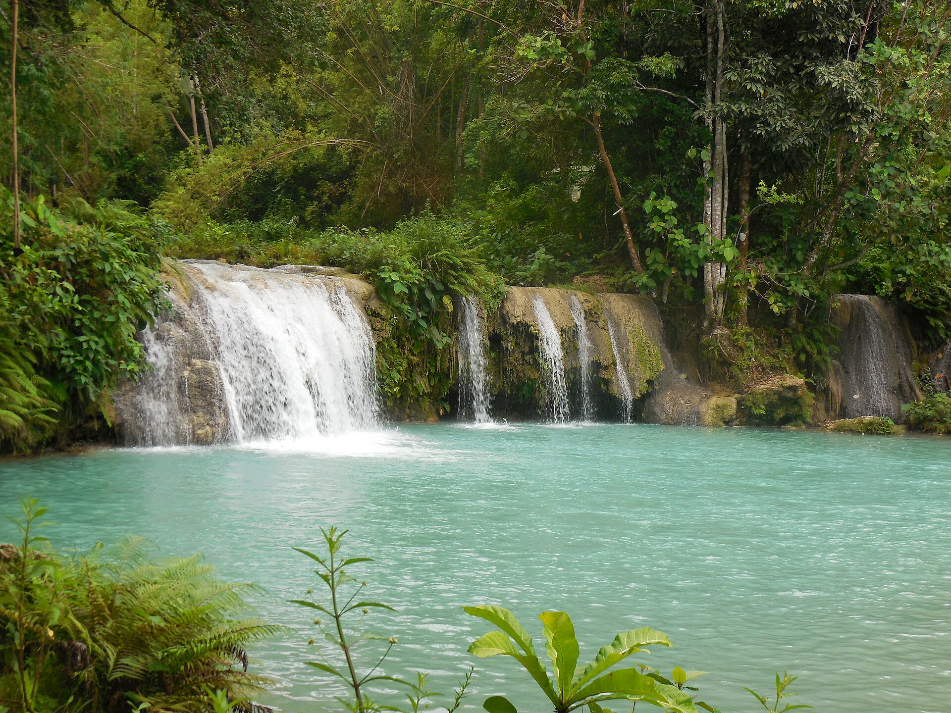 The stunning three-tiered Cambugahay Falls, perfect for a refreshing swim.